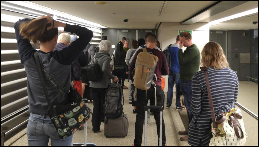People waiting in airport jetway